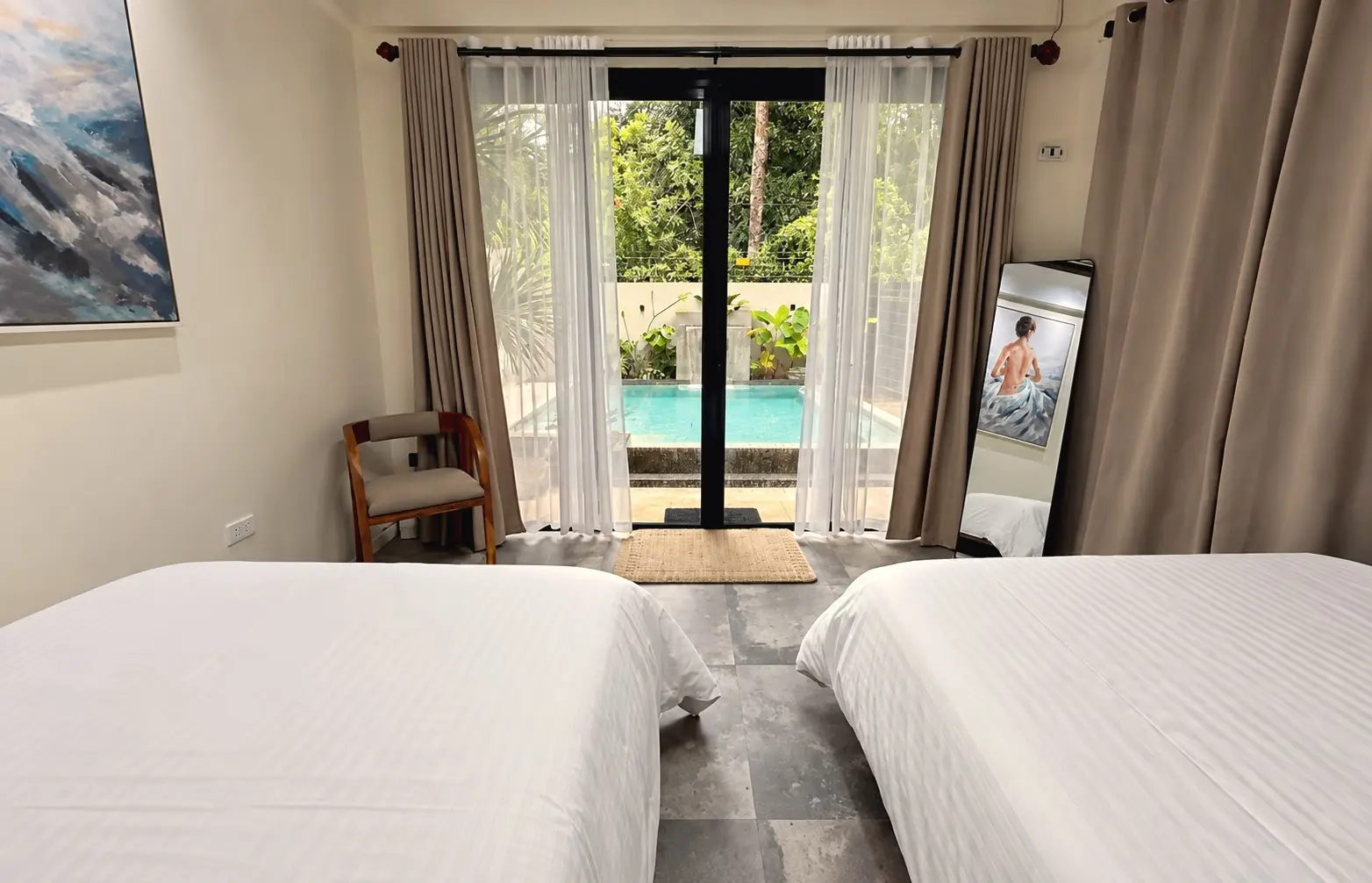 Bedroom with a glass door to the pool